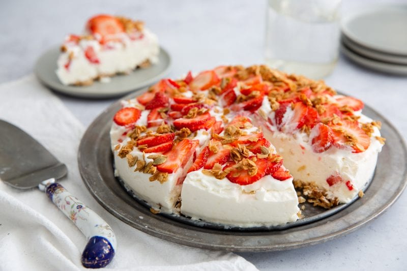 pie topped with fresh strawberries and granola