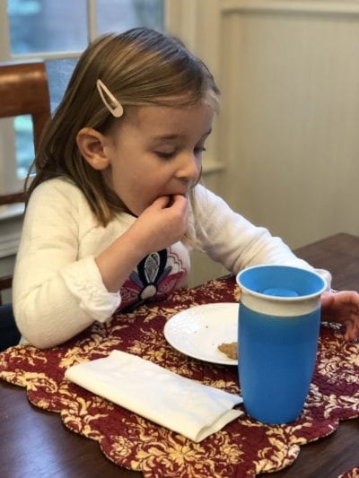 a child eats granola cookies